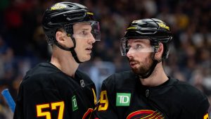 Vancouver Canucks' Tyler Myers (57) and Marcus Pettersson (29) talk before a face off against the Boston Bruins during the second period of an NHL hockey game in Vancouver, on Saturday, January 3, 2026. (Ethan Cairns/CP)