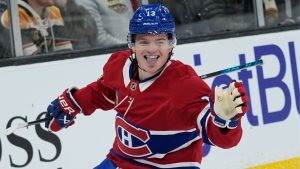 Montreal Canadiens right wing Cole Caufield celebrates after his goal during the first period of an NHL hockey game against the Boston Bruins in Boston, Saturday, Jan. 24, 2026. (Robert F. Bukaty/AP Photo)