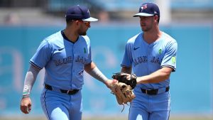 Toronto Blue Jays shortstop Bo Bichette, left, congratulates second baseman Ernie Clement after catching a pop fly during the first inning of a baseball game, Sunday, May 25, 2025, in Tampa, Fla. (Phelan M. Ebenhack/AP)