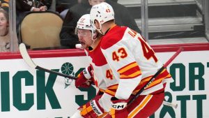 Calgary Flames' Connor Zary (47) celebrates after scoring with Adam Klapka (43) during the first period of an NHL hockey game against the Pittsburgh Penguins in Pittsburgh, Saturday, Jan. 10, 2026. (Gene J. Puskar/AP)