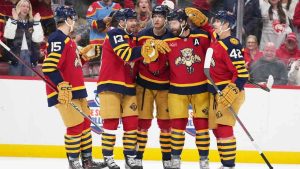 Florida Panthers defenseman Aaron Ekblad, second from right, is congratulated after scoring a goal during the second period of an NHL hockey game against the Colorado Avalanche, Sunday, Jan. 4, 2026, in Sunrise, Fla. (Lynne Sladky/AP)