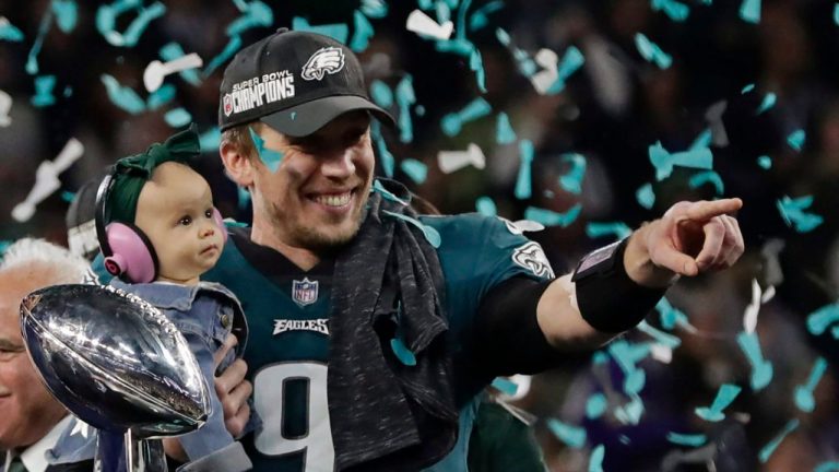 Philadelphia Eagles quarterback Nick Foles (9) holds his daughter, Lily James, after winning the NFL Super Bowl 52 football game against the New England Patriots, Sunday, Feb. 4, 2018, in Minneapolis. (Frank Franklin II/AP)