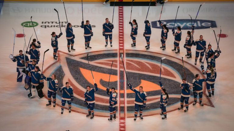 Vancouver Goldeneyes players gather at centre ice and salute the crowd before a PWHL hockey game against the Seattle Torrent, in Vancouver, on Friday, November 21, 2025. (Darryl Dyck/CP)