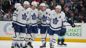 Toronto Maple Leafs defenseman Morgan Rielly, far right, celebrates his goal against the Seattle Kraken with teammates during the third period. (Lindsey Wasson/AP)