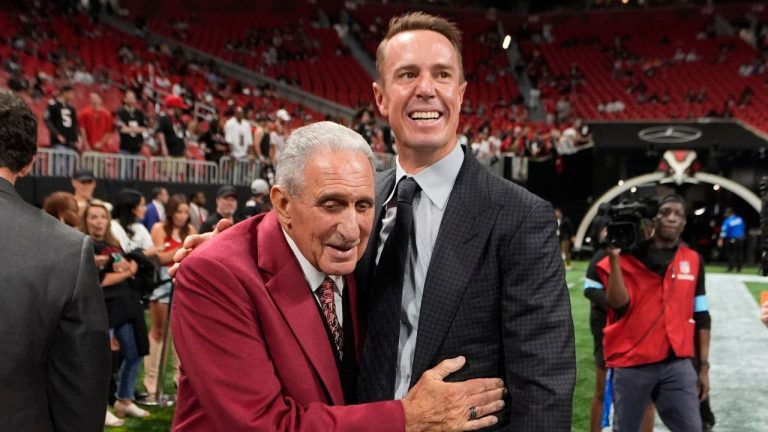 Atlanta Falcons owner Arthur Blank, left, talks to former quarterback Matt Ryan before an NFL football game against the Tampa Bay Buccaneers Oct. 3, 2024, in Atlanta. (John Bazemore/AP)