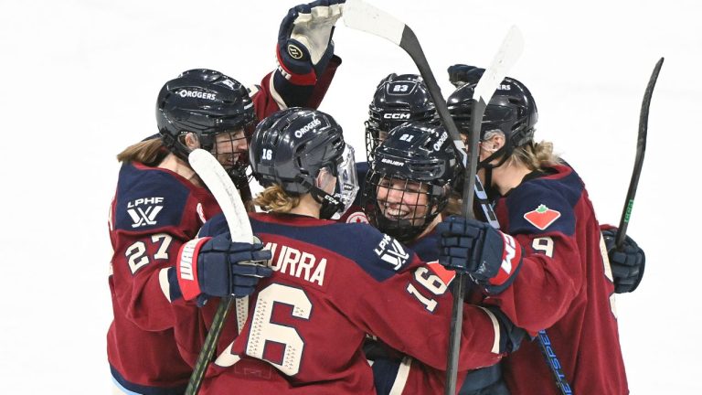 Montreal Victoire's Maureen Murphy (21) celebrates with teammates Hayley Scamurra (16) Shiann Darkangelo (27), Erin Ambrose (23) and Kati Tabin (9) after scoring against the Ottawa Charge during first period PWHL hockey action in Laval, Que., Saturday, Jan. 24, 2026. (Graham Hughes/CP)