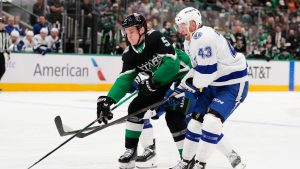 Dallas Stars defenceman Nils Lundkvist (5) works for control of the puck in front of Tampa Bay Lightning defenceman Darren Raddysh (43) in the first period of an NHL hockey game in Dallas, Sunday, Jan. 18, 2026. (Tony Gutierrez/AP)