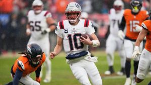 New England Patriots quarterback Drake Maye runs against the Denver Broncos during the second the half of the AFC Championship NFL football game, Sunday, Jan. 25, 2026, in Denver. (John Locher/AP)