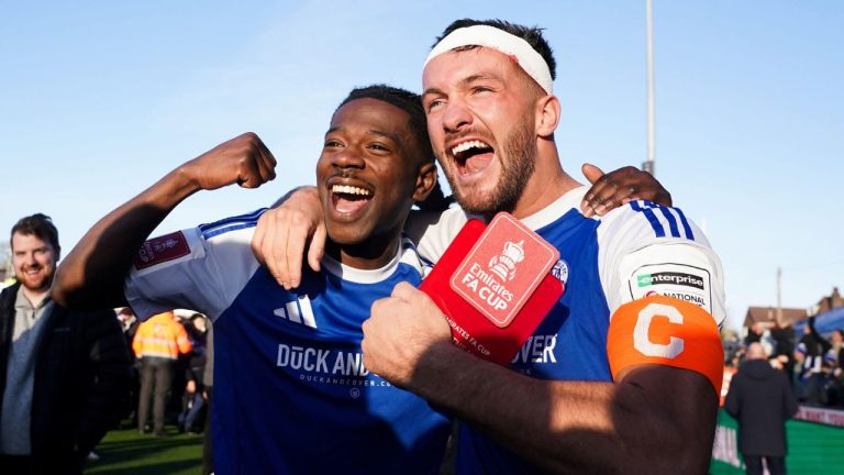 Macclesfield FC goalscorers Paul Dawson, right and Isaac Buckley-Ricketts celebrate following the FA Cup third round soccer match between Macclesfield Town and Crystal Palace, at the Leasing.com Stadium, Macclesfield, England, Saturday, Jan. 10, 2026. (Martin Rickett/PA via AP)