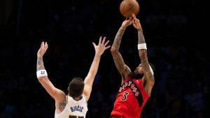 Toronto Raptors forward Brandon Ingram (3) shoots over Los Angeles Lakers guard Luka Doncic (77) during the first half of an NBA basketball game in Los Angeles, Sunday, Jan. 18, 2026. (Kyusung Gong/AP)