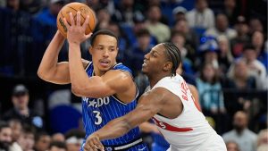 Orlando Magic guard Desmond Bane (3) tries to get past Toronto Raptors forward RJ Barrett, right, during the second half of an NBA basketball game, Friday, Jan. 30, 2026, in Orlando, Fla. (John Raoux/AP)