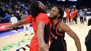 Toronto Raptors guard Immanuel Quickley, right, celebrates after an NBA basketball game against the Oklahoma City Thunder, Sunday, Jan. 25, 2026, in Oklahoma City. (Nate Billings/AP Photo)