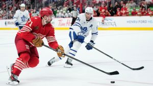 Detroit Red Wings center Dylan Larkin, left, skates against Toronto Maple Leafs center John Tavares during overtime of an NHL hockey game, Sunday, Dec. 28, 2025, in Detroit. (Ryan Sun/AP)