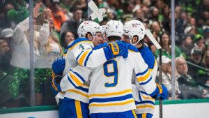 Buffalo Sabres defenceman Bowen Byram (4) celebrates a goal with teammates during an NHL hockey game against the Dallas Stars, Wednesday, Dec. 31, 2025, Dallas. (Jessica Tobias/AP)