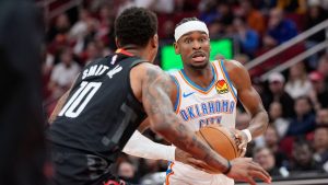Oklahoma City Thunder's Shai Gilgeous-Alexander, right, drives to toward the basket as Houston Rockets' Jabari Smith Jr. (10) defends during the first half of an NBA basketball game Thursday, Jan. 15, 2026, in Houston. (David J. Phillip/AP)