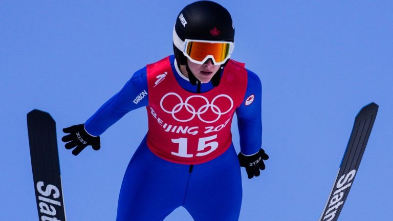 Abigail Strate, of Canada, soars through the air during a women's normal hill ski jumping training session at the 2022 Winter Olympics, Friday, Feb. 4, 2022, in Zhangjiakou, China. (Andrew Medichini/AP Photo)