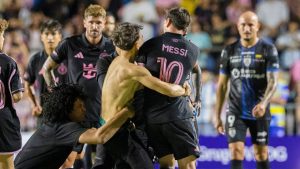 A fan who got onto the field grabs Inter Miami's Lionel Messi at the end of an international friendly soccer match against Ecuador's Independiente del Valle in Bayamon, Puerto Rico, Thursday, Feb. 26, 2026. (Alejandro Granadillo/AP)