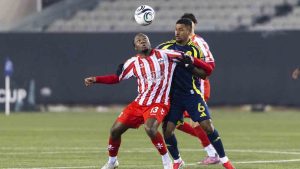 Atletico Ottawa's Ballou Tabla (13) fights for the ball with Nashville SC's Bryan Acosta (6) during round one of the 2026 CONCACAF Champions Cup in Hamilton, Tuesday, Feb. 17, 2026. (Nick Iwanyshyn/CP)