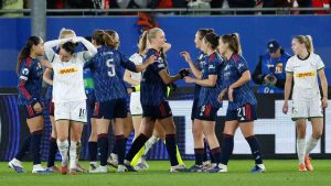 Arsenal players celebrate after Arsenal's Frida Maanum scored the opening goal during the women's Champions League knockout play-off soccer match between OH Leuven and Arsenal in Leuven, Belgium, Wednesday, Feb. 11, 2026. (Geert Vanden Wijngaert/AP)