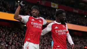 Arsenal's Noni Madueke and Arsenal's Bukayo Saka celebrate scoring their side's first goal during the English FA Cup match between Arsenal and Wigan Athletic in London, Sunday, Feb. 15, 2026.(AP/Maja Smiejkowska)