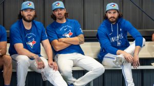 Toronto Blue Jays pitchers (left to right) Cody Ponce, Kevin Gausman and Dylan Cease watch bullpen sessions at Spring Training in Dunedin, Fla. on Wednesday Feb. 11, 2026. (Frank Gunn/CP)