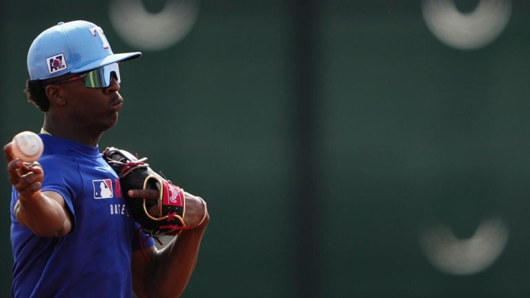 Texas Rangers infielder Sebastian Walcott throws while running fielding drills during spring training baseball practice at the team's training facility Monday, Feb. 17, 2025, in Surprise, Ariz. (Photo/Lindsey Wasson)