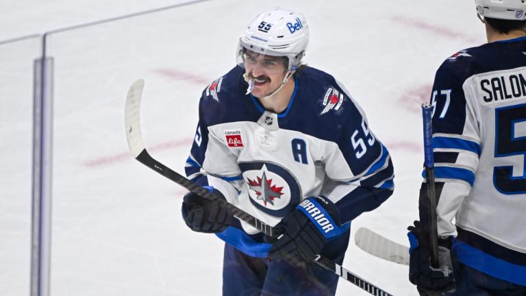 Winnipeg Jets center Mark Scheifele (55) celebrates after scoring a goal against the Minnesota Wild during the second period of an NHL hockey game Thursday, Jan. 15, 2025, in St. Paul, Minn. (Craig Lassig/ AP)