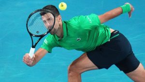 Novak Djokovic of Serbia plays a forehand return to Carlos Alcaraz of Spain in the men's singles final match at the Australian Open tennis championship in Melbourne, Australia, Sunday, Feb. 1, 2026. (AP Photo/Dar Yasin)