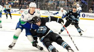 Utah Mammoth center Nick Schmaltz (8) falls against Vancouver Canucks right wing Jonathan Lekkerimaki (23) during the first period of an NHL hockey game Monday, Feb. 2, 2026, in Salt Lake City. (Melissa Majchrzak/AP)