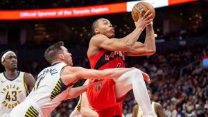 Toronto Raptors forward Scottie Barnes (4) is fouled by Indiana Pacers guard T.J. McConnell (9) during second half NBA action in Toronto, Sunday, Feb. 8, 2026. (Frank Gunn/CP)
