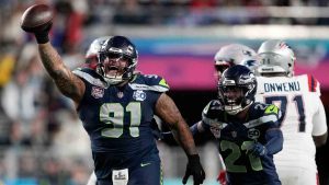 Seattle Seahawks defensive tackle Byron Murphy II (91) celebrates with cornerback Devon Witherspoon (21) after recovering a fumble by New England Patriots quarterback Drake Maye during the second half of the NFL Super Bowl 60 football game, Sunday, Feb. 8, 2026, in Santa Clara, Calif. (Doug Benc/AP)