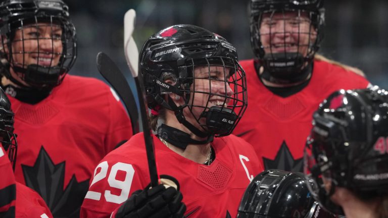 Canada's Marie-Philip Poulin gathers with teammates during warmups before a preliminary round match of women's ice hockey against Czechia at the 2026 Winter Olympics, in Milan, Italy, Monday, Feb. 9, 2026. (Carolyn Kaster/AP)