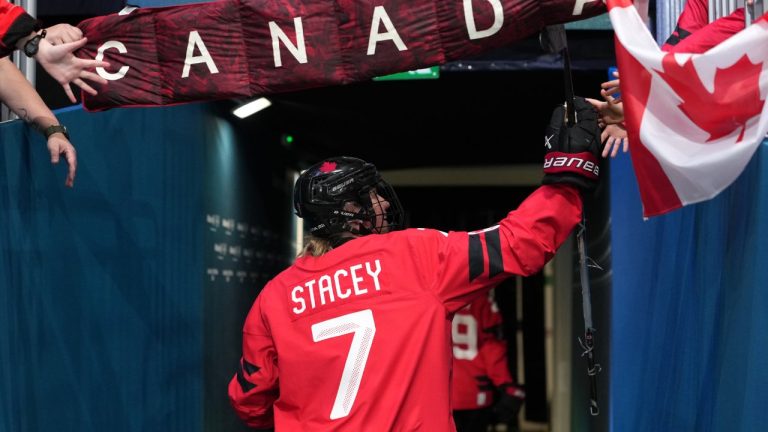 Canada's Laura Stacey greets fans before the start of a women's ice hockey quarterfinal match between Canada and Germany at the 2026 Winter Olympics, in Milan, Italy, Saturday, Feb. 14, 2026. (AP Photo/Carolyn Kaster)