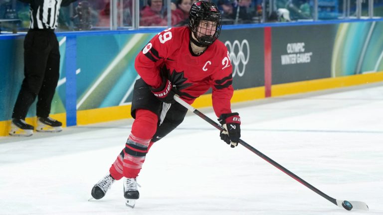 Canada's Marie-Philip Poulin prepares to take a shot during the second period of a women's hockey quarterfinal game against Germany at the 2026 Winter Olympics, in Milan, Saturday, Feb. 14, 2026. (Darryl Dyck/CP)