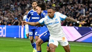 Marseille's Igor Paixao, front, and Strasbourg's Diego Moreira vie for the ball during the French League One soccer match between Marseille and Strasbourg in Marseille, France, Saturday, Feb. 14, 2026. (Philippe Magoni/AP)