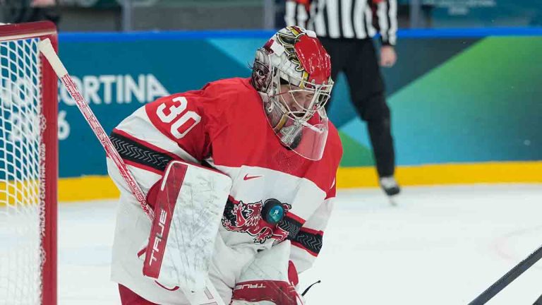 Denmark's goalkeeper Mads Sogaard makes a saveduring a preliminary round match of men's ice hockey between United States and Denmark at the 2026 Winter Olympics, in Milan, Italy, Saturday, Feb. 14, 2026. (Petr David Josek/AP)