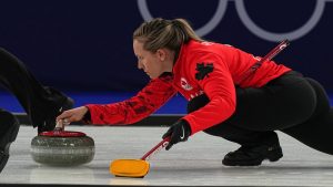 Canada's Rachel Homan in action during the women's curling round robin session against Switzerland at the 2026 Winter Olympics, in Cortina d'Ampezzo, Italy, Saturday, Feb. 14, 2026. (AP Photo/Fatima Shbair)