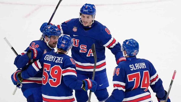United States' Jake Guentzel, second left, celebrates after scoring his side's fifth goal during a preliminary round match of men's ice hockey between United States and Denmark at the 2026 Winter Olympics, in Milan, Italy, Saturday, Feb. 14, 2026. (Petr David Josek/AP)