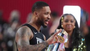 Portland Trailblazers guard Damian Lillard holds the winner's trophy after the 3-point contest at the NBA basketball All-Star weekend festivities Saturday, Feb. 14, 2026, in Inglewood, Calif.(Jae C. Hong/AP)