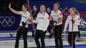 Canada's Rachel Homan, Tracy Fleury, Sarah Wilkes and Emma Miskew react after the women's curling round robin session against China at the 2026 Winter Olympics, in Cortina d'Ampezzo, Italy, Monday, Feb. 16, 2026. (AP Photo/Fatima Shbair)