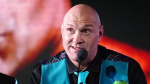 Tyson Fury speaks during a press conference at Tottenham Hotspur Stadium in London, Monday, Feb. 16, 2026. (Adam Davy/PA via AP)
