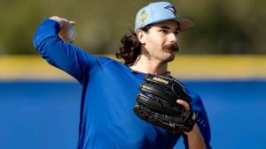 Toronto Blue Jays pitcher Dylan Cease makes a throw to first base during a drill at Spring Training in Dunedin, Fla., on Monday, Feb. 16, 2026. (Frank Gunn/CP)