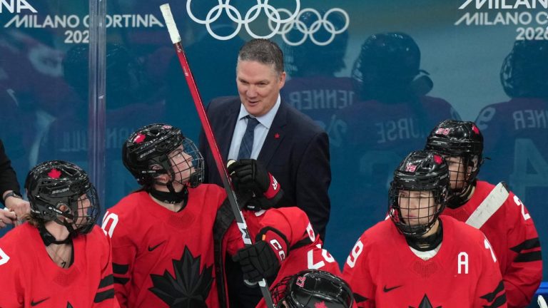 Canada head coach Troy Ryan talks with his players during the third period of a women's ice hockey semifinal match against Switzerland at the 2026 Winter Olympics, in Milan, Italy, Monday, Feb. 16, 2026. (Carolyn Kaster/AP)