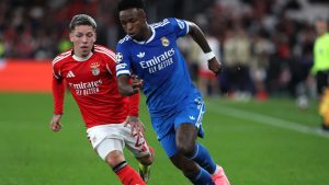 Benfica's Gianluca Prestianni fights for the ball against Real Madrid's Vinicius Junior during a Champions League playoff soccer match between SL Benfica and Real Madrid in Lisbon, Portugal, Tuesday, Feb. 17, 2026. (Pedro Rocha/AP)