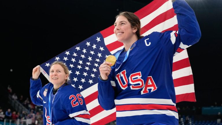 United States' Kendall Coyne, left, and United States' Hilary Knight celebrate after victory ceremony for women's ice hockey at the 2026 Winter Olympics, in Milan, Italy, Thursday, Feb. 19, 2026. (Hassan Ammar/AP)