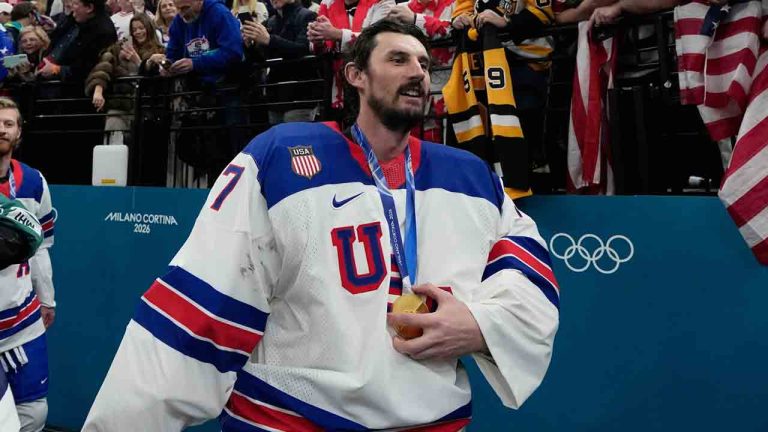United States' Connor Hellebuyck (37) celebrates after the United States defeated Canada in a men's ice hockey gold medal game between Canada and the United States at the 2026 Winter Olympics, in Milan, Italy, Sunday, Feb. 22, 2026. (Petr David Josek/AP)