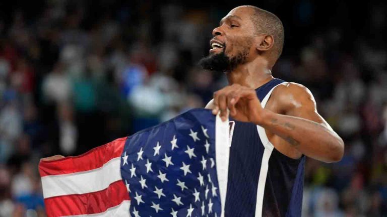 United States' Kevin Durant (7) celebrates after beating France to win the gold medal during a men's gold medal basketball game at Bercy Arena at the 2024 Summer Olympics, Saturday, Aug. 10, 2024, in Paris, France. (Rebecca Blackwell/AP)