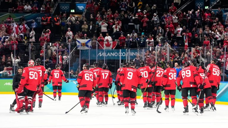 Canada players celebrate at the end of a men's ice semifinal game between Canada and Finland at the 2026 Winter Olympics, in Milan, Italy, Friday, Feb. 20, 2026. (AP/Hassan Ammar)