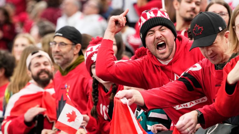 Fans cheer before a men's ice hockey gold medal game between Canada and the United States at the 2026 Winter Olympics, in Milan, Italy, Sunday, Feb. 22, 2026. (Hassan Ammar/AP)