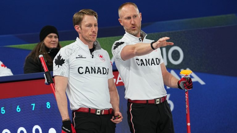 Canada's Marc Kennedy and Brad Jacobs compete in a men's curling semifinal match against Norway at the 2026 Winter Olympics, in Cortina d'Ampezzo, Italy, Thursday, Feb. 19, 2026. (Fatima Shbair/AP)